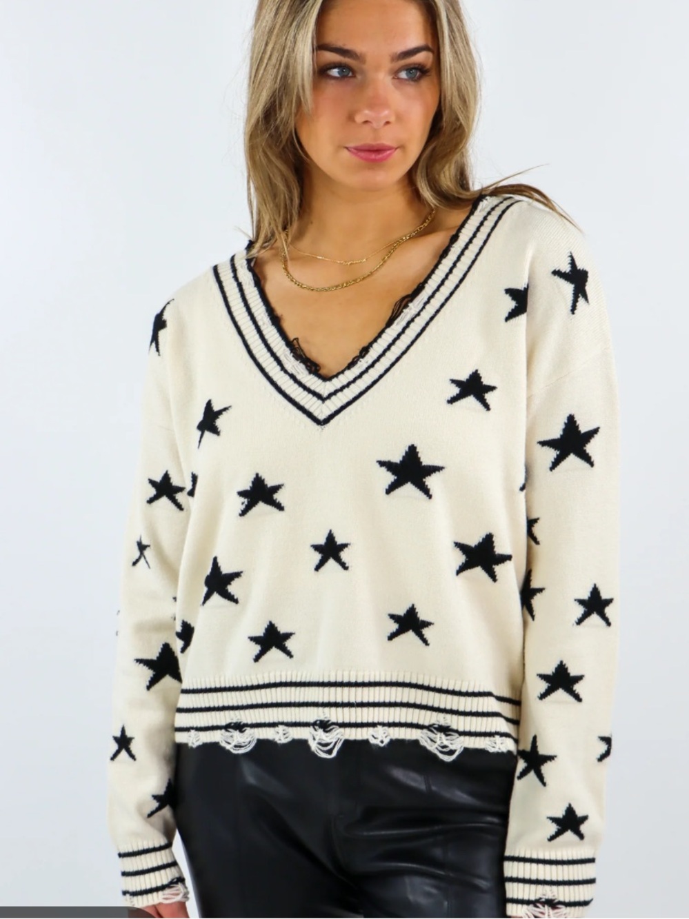 Women’s distressed White Star V-Neck Sweater